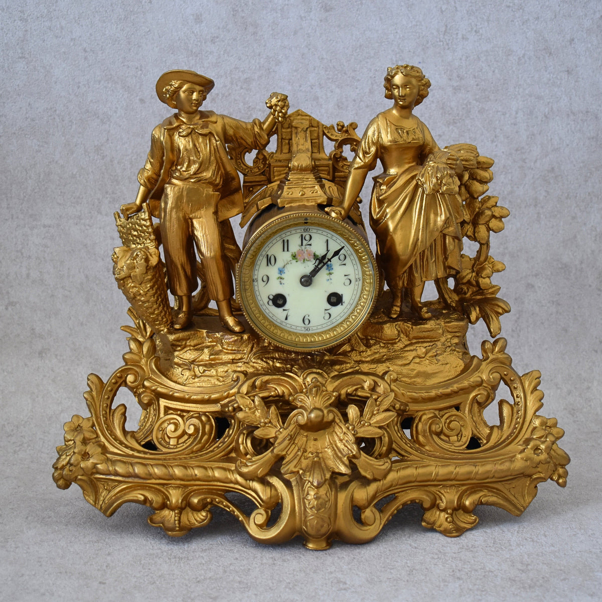 Antique French gilt bronze figural mantel clock